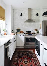 In a modern farmhouse, the apron sink and appliances are more likely to be stainless steel. Tour A Stylist S Mid Century Meets Traditional Farmhouse Full Of Thrifted Treasures Emily Henderson