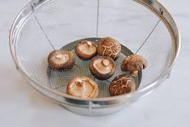 Arrange the mushrooms on the racks, then assemble the dehydrator. How To Dry Mushrooms No Special Equipment Needed The Woks Of Life