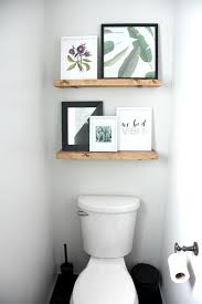 Upcycled cabinet bathroom storage idea. How To Reinvent Your Bathroom With Over The Toilet Shelves