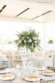 We think that for this nothing can be better than our flower center pieces comprising. Elevated Arrangement Green Wedding Centerpieces Green And White Wedding Flowers Rose Centerpieces Wedding