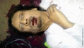 So far it's unclear if he was killed or died of wounds sustained during the capture by ntc forces. Muammar Gaddafi Death Photo