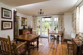 For an upgraded version of traditional interior french doors, divide the living room and dining room with clear sliding doors. Dining Area That Leads From The French Doors Onto The Garden Picture Of Lavender Cottage Bed Breakfast Dunkerton Tripadvisor