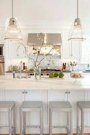 Stunning White Kitchen With Wide Marble Kitchen Island Custom Cabinets Vintage Glass Pendant Lights And Kitchen Inspirations Kitchen Style Dream Kitchen