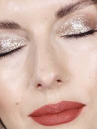 How To Wear Glitter Makeup Without Looking Like Tinsel Byrdie Com Christmas Makeup Look Top Makeup Products Glitter Makeup Looks