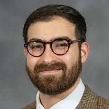 PERI faculty members (from left) Steven Sprick Schuster, Daniel Smith, and  Ennio Piano celebrate PERI Fellow Protik Nandy's suc