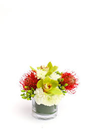 This Arrangement May Be Small But It Packs A Punch Bright Red Pincushion Protea Offset Green H Tropical Flower Arrangements Hypericum Berries Cocktail Tables