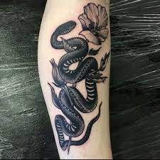 Scary snake tattoose on the leg. Scott Move Tattoo Snake Tattoo Snake Tattoo Design Leg Tattoos