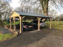 This cypress timber framed carport was added next to the home's garage to provide additional covered parking. Car Parking Shelters Shields Buildings