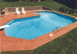 A True L Grecian Featuring A Different Style Of Decking Pavers Spa Pool Swimming Pool Builder Swimming Pool Hot Tub