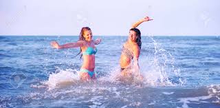 Free for commercial use no attribution required high quality images. Young Women Playful Bathing Summer Moments On The Beach At Sunset Stock Photo Picture And Royalty Free Image Image 83091641
