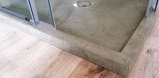 The Customized Concrete Shower Bases Sinks And Coverings Are Hand Finished Resistant And Easy To Clean Concrete Shower Shower Base Gold Bathroom Set