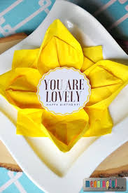On the left of the plate, place the dinner fork on the napkin. Flower Paper Napkin Folding With Sunflower Table Decorations