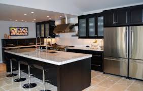 This contemporary kitchen takes spanish influences to create this look, creating a rustic yet modern feel to the space. Contemporary Kitchen Dark Cabinetry Studio 76 Kitchens Baths