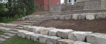 Armour stone is a great way to add a unique natural look to any landscape whether it be a commercial landscape or a residence. Pro Loc Interlocking Landscape Design Ltd Pro Loc