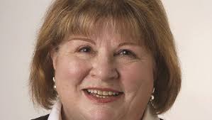 Commissioner candidate announces husband's death