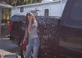 Follow the signs and see where you end up. Woman Having Fun While Washing Car Outside Garage Pipe Service Stock Photo 209277756