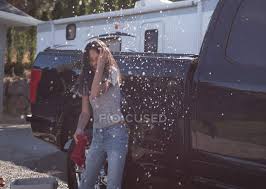 We've all been in that situation where we've asked ourselves; Woman Having Fun While Washing Car Outside Garage Pipe Service Stock Photo 209277756