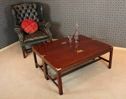 Mid century campaign style coffee table, table is 2 pieces, solid oak with brass mounts on corners, rosewood sting inlay in top, 3 drawers with dovetailed construction, shelf below on base, brass serial number tags on top and base this item includes restricted materials and can not be sold outside of the contiguous united states. Antiques Atlas Pair Campaign Style Coffee Tables