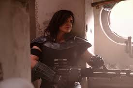 Gina joy carano (born april 16, 1982)1 is an american actress and former mma fighter who plays carasynthia dune, a character in the disney+ television series the mandalorian, which premiered in 2019. Star Wars Gina Carano Embraces Her Strength With Latest Saga The Mandalorian