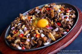 24 Delicious Filipino Foods You Need In Your Life Sisig Recipe Pork Sisig Food