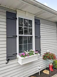 The custom shutter is designed to fit your exact sizing and styling needs. 14 Inch W X 63 Inch H Lifetime Vinyl Standard Four Board Joined Board N Batten Shutters W Installation Shutter Lok S Matching Screws Per Pair Tuxedo Gre Shutters Exterior Outdoor Shutters House Shutters