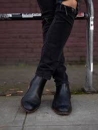The golden serial number stamped above the heel is the brand's calling card. How To Wear Chelsea Boots Next Level Gents