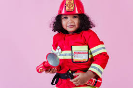Ethnic girl in firefighter costume with fake megaphone · Free Stock Photo