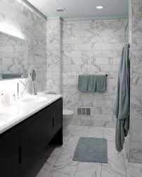 The panels apply the mirror to get clear visual bathroom space. Trendy Bathroom With An Undermount Sink Flat Panel Cabinets Black Cabinets Marble Countertops Grey Marble Bathroom White Marble Bathrooms Marble Bathroom Floor