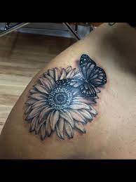Daisy And Butterfly Tattoo By Audrey Mello Daisy And Butterfly Tattoo Sunflower Tattoo Shoulder Tattoos
