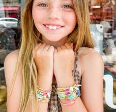 I'm not sure who's more excited that we're stocking these new gold-filled,  water-resistant, charm bracelets. Me or Ella! We have gummy bear,  butterfly, and ice cream bracelets in stock. These are so