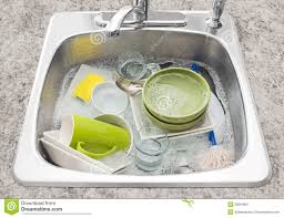 dishes soaking in the kitchen sink