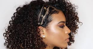 You can even create a slightly different look by parting your hair in the middle or to the side when creating a low ponytail. Side Swept Curls Hairstyles Naturallycurly Com Naturallycurly Com