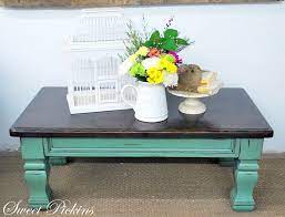 A round glass top and a distressed golden base perfectly complement bright blue french art deco chairs in this upstate new york farmhouse. Products Archive Milkpaint Distressed Coffee Table Painted Coffee Tables Reclaimed Wood Dining Table