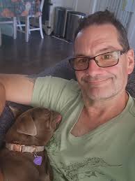 Are all 5 dogs visible in the group shot?