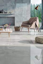 This matte, 24x48 tile mimics an ashy wood tone with the appearance of a slight, grainy texture. Samantha Grey Matt Floor Tile British Ceramic Tile Specification Living Room Tiles Living Room Grey Tile Floor Living Room
