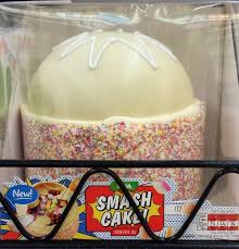 When the cakes are cool, frost the top of one of the cakes with chocolate frosting and top with the second cake, placing the second cake upside down on top so that the bottom of the cake is now the top. Vanilla Smash Cake Asda Uk Filled With Candy Cake Smash Cake Food
