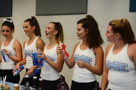 Senior Liddy Stallard, junior Gretchen Raedle, sophomore Katie Reda,  freshman Celia Condon, and sophomore Meredith McGannon are excited to serve  people at the Lancer Dancer Pancake Breakfast. Photo by Sarah Golder |