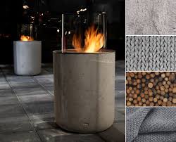 bio ethanol fireplace jar commerce by planika the coldness of concrete which contrasts nicely with fire wood gr buitendecoraties open haard buiten tuinhaard