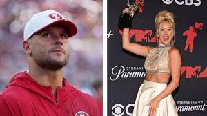 Megan Moroney supporting Nick Bosa