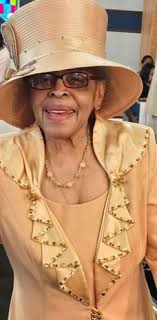 Dorothy Sneed standing by car outside Bethlehem Baptist Church, Lawton,  Oklahoma. Date 1984
