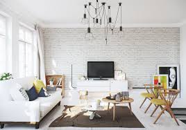 Poster with vertical frames on empty white wall in living room interior with blue velvet armchair. Making Of Scandinavian Apartment White Brick Wall Living Room Brick Interior Wall Brick Living Room