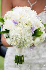 Wilflowers make gorgeous summer wedding bouquets. Wedding Bridal Bouquet Hydrangea Peonies Ranunculus Lavender Lisianthus Lavender Wedding Romanti Lavender Wedding Wedding Bouquets Wedding Bridal Bouquets