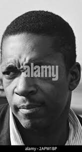 Portrait of John Coltrane; American jazz saxophonist John Coltrane arrived  at Schiphol Stock Photo