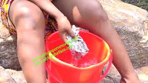 Hot and wild public fuck at the river between a bodybuilder and a neighbor  during laundry in Cameroon, Africa. to see exclusively on xvideos red watch  online