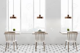 The designer used sheesham, a type of indian rosewood ideal for heirloom tables because of its strength, durability and add a collection. Interior Of Loft Cafe With White Walls Tiled Floor Square Wooden Stock Photo Picture And Royalty Free Image Image 113584874