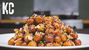 Method 1 to begin, pour the flour on a clean work surface and mix in the sugar, salt, lemon zest, eggs and the softened butter. Struffoli Recipe Italian Honey Balls Youtube