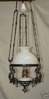 A hanging lamp spreads light into the darkest corner better than a table lamp can. Dutch Antique Cast Iron Hanging Oil Lamp 1890 1920 35323151