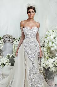 Designers are giving simple off the shoulder gowns an update with puffy tulle or lace sleeves that add interest to the overall look. Dubai Wedding Dresses Designers Arabia Weddings