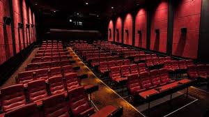 Exterior Of Amc Downtown Disney 24 Theatres With Neon Signs Lit Up At Night Dine In Theater Disney World Resorts Disney World Restaurants