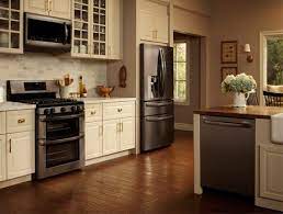 If, while deciding what color cabinets look best with black stainless steel appliances, you choose natural wood, dark oaks are ideal. 10 Decorating Ideas For Above Kitchen Cabinets Stainless Steel Kitchen Appliances Kitchen Design Black Stainless Steel Appliances